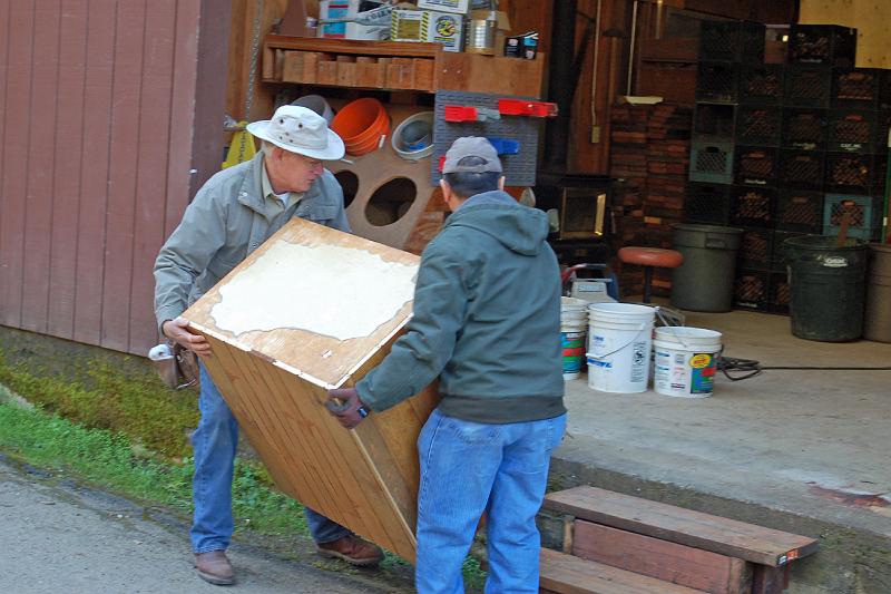 Leland and Art Lift Cabinet.jpg - After lunch, Art Holtz (left) and Leland Wong lift a cabinet into the tool shed, for refacing. They spent the day on this cabinet project.